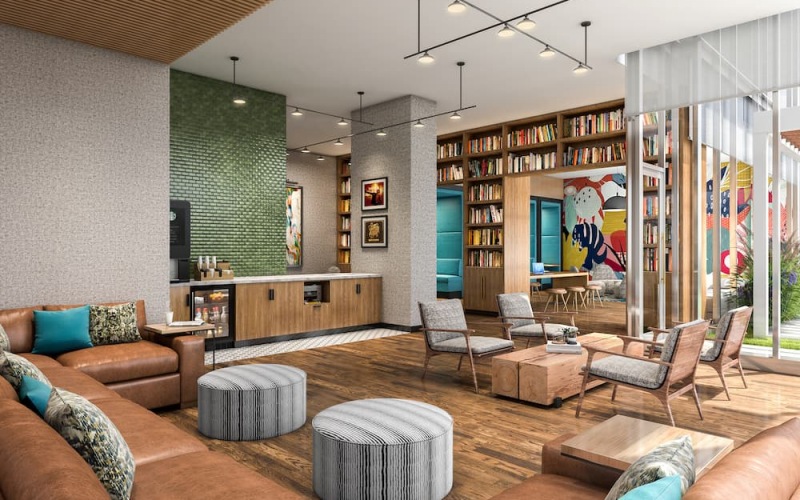 Lounge with shelves and colorful accents, seating and high ceilings at 903 Peachtree